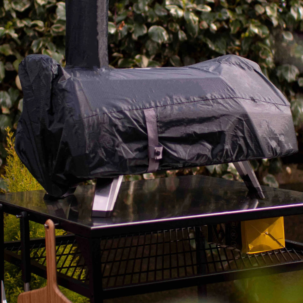 Black cover for pizza oven outdoors