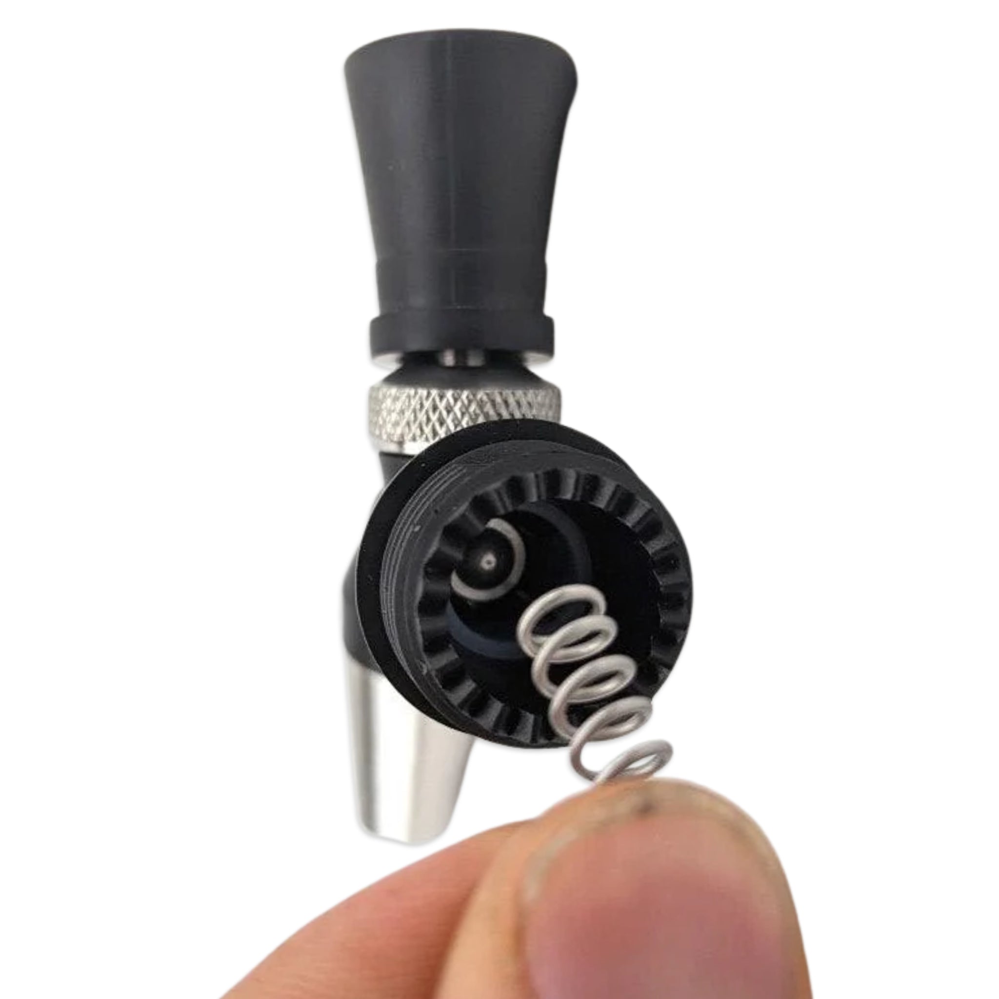 Close-up of a small mechanical component held by a hand against a white background