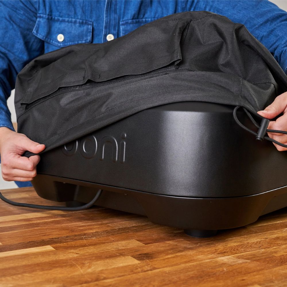 Cover for Ooni Volt 12 includes an elasticated edge with draw string for a snug fit.