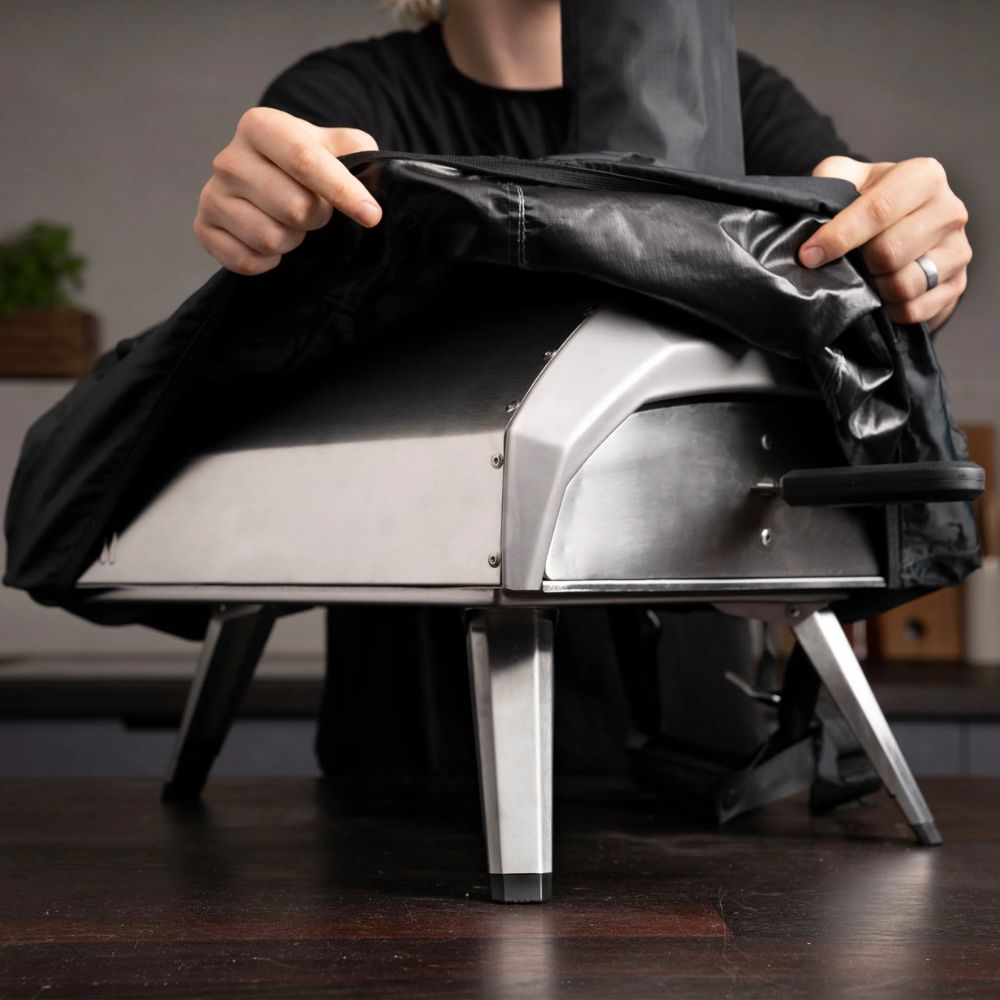 Black waterproof carry cover for the Ooni Karu 12 & 12G with an elasticated edge for a snug fit.