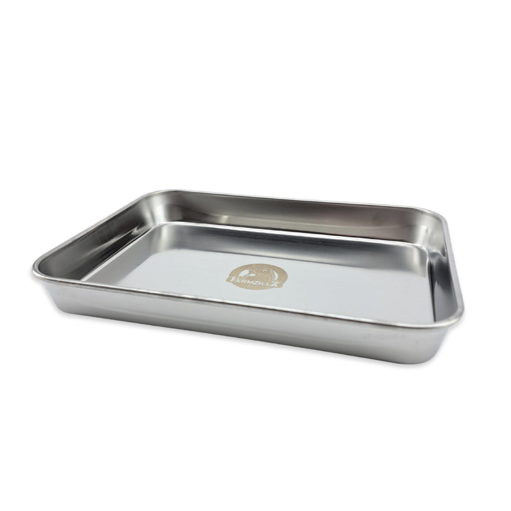 Stainless steel drip tray on a white background