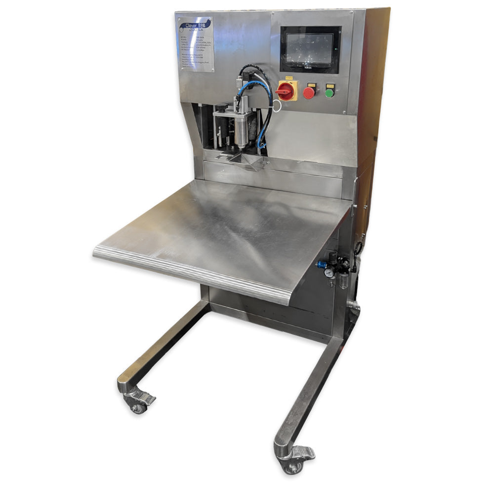 Stainless steel machine with a flat work surface on a white background