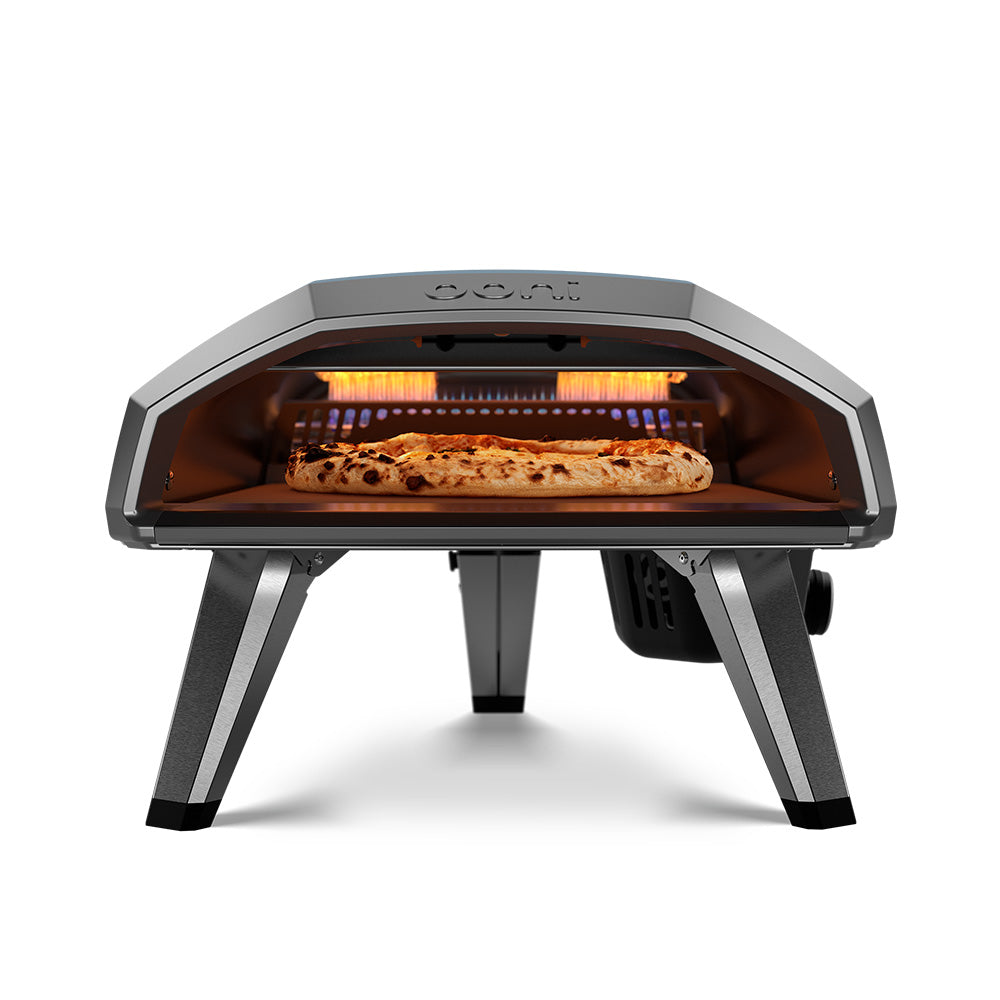 Ooni Koda 2 Foundry Black - 14 Inch Gas Powered Pizza Oven - Front View with flame and pizza cooking.