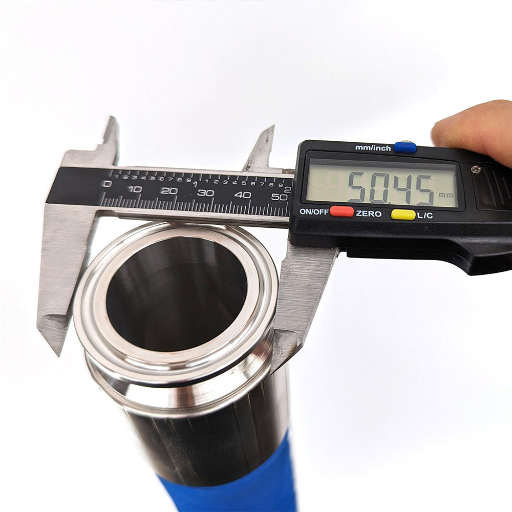 Digital caliper measuring a metal bearing with a white background