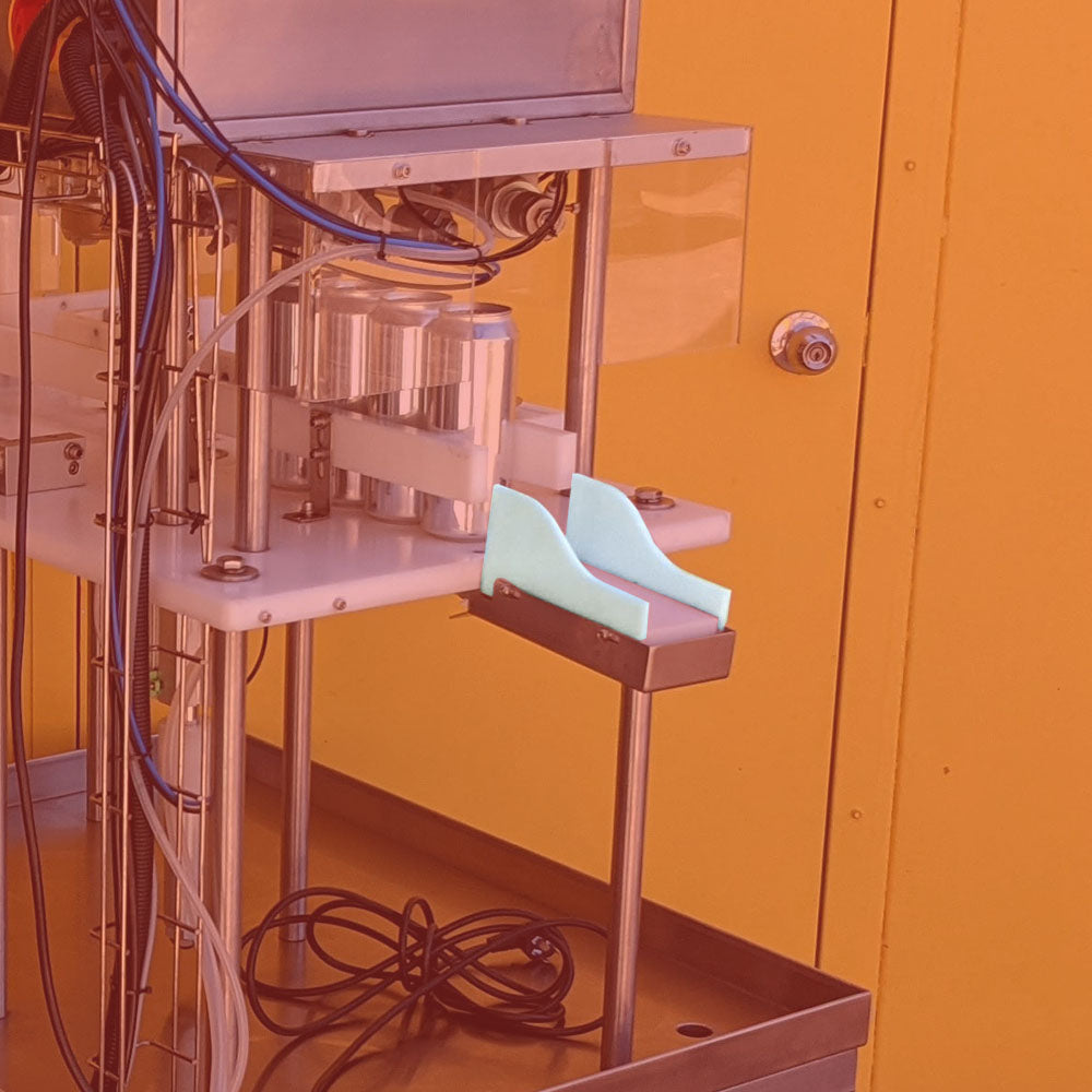 Plate guards pictured attached to Single Lane Canning Machine