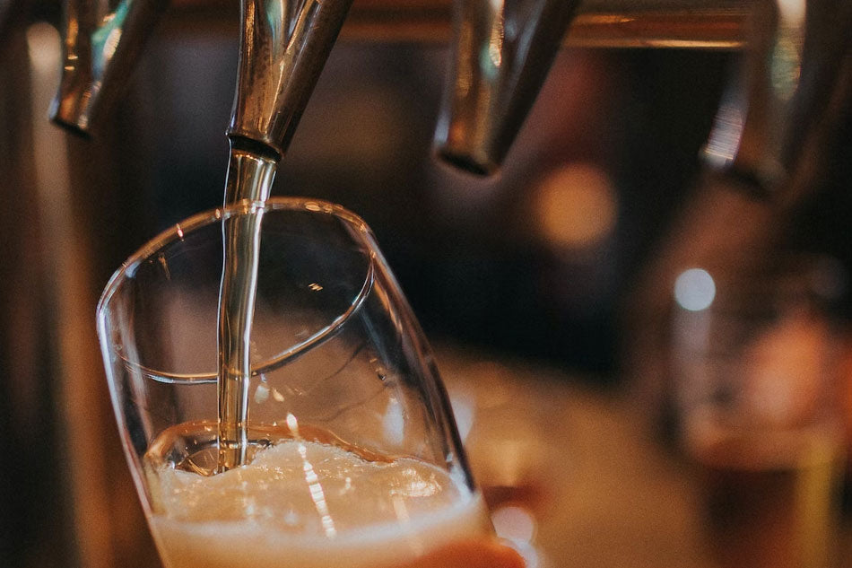 Smooth beer pour from a KegLand kegs, showcasing the perfect balance of carbonation and head, capturing the essence of a refreshing and enjoyable drinking experience