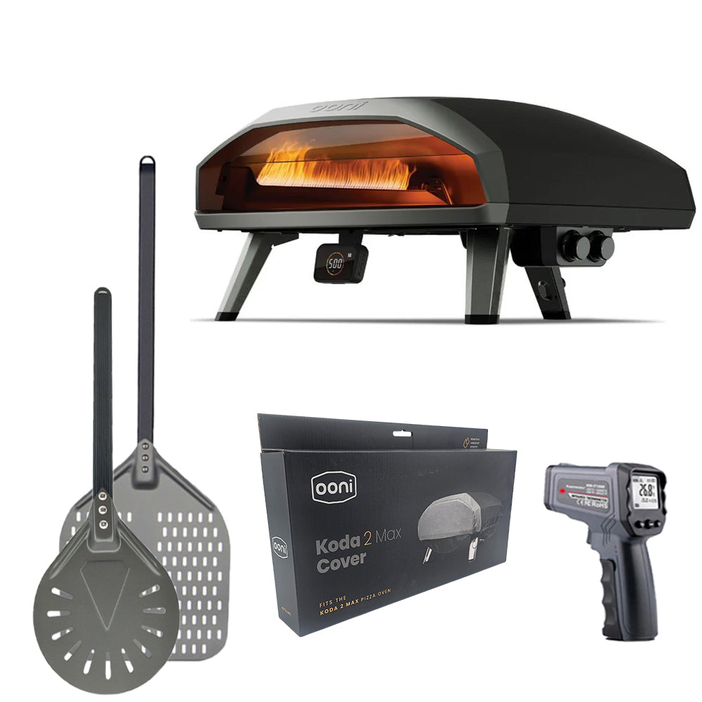 Ooni Koda 2 Max Pizza Oven with accessories including pizza peel, spinner peel, waterproof cover and infrared thermometer.