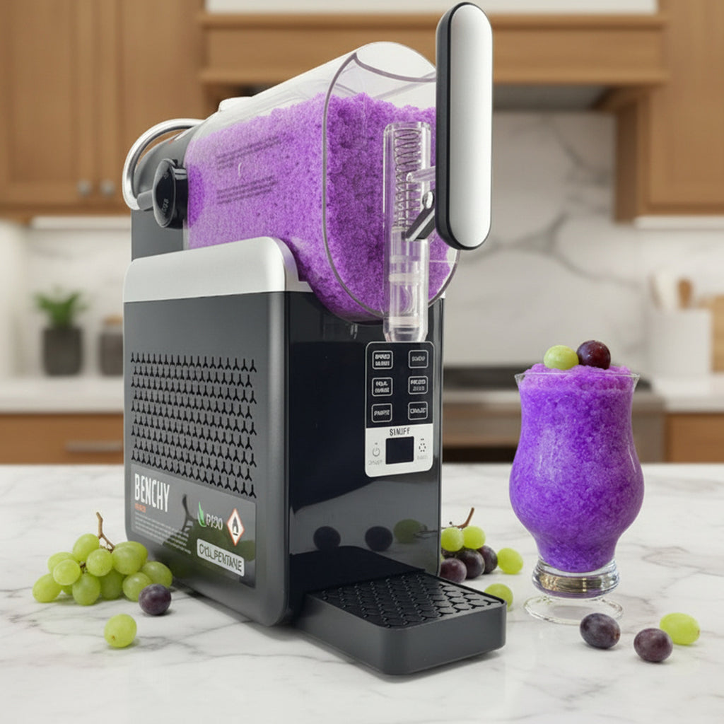 Benchy Slushy with a Purple Grape Slushy mixture on display with ample green and purple grapes around it.