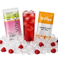 A cocktail mix product setup on a white background with a glass of red iced cocktail, surrounded by ice cubes and raspberries, flanked by two product packets: Aynin Base and U-Fizz Raspberry Soda Mix.