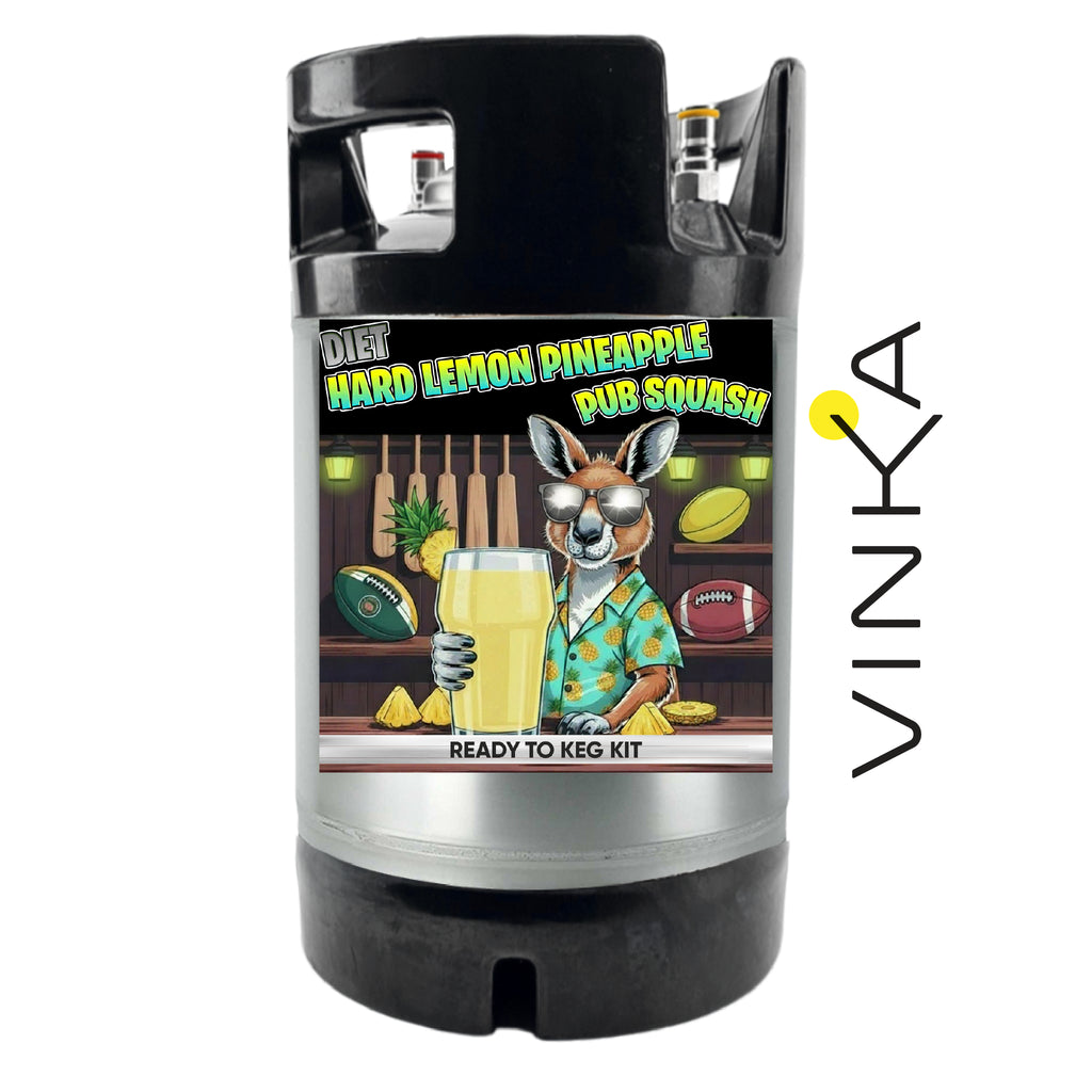 A black and silver kegerator with a colorful cartoon label reading 'Diet Hard Lemon Pineapple Pub Squash' and 'Ready to Keg Kit.' A vertical 'VINKA' logo appears on the right side of the image.