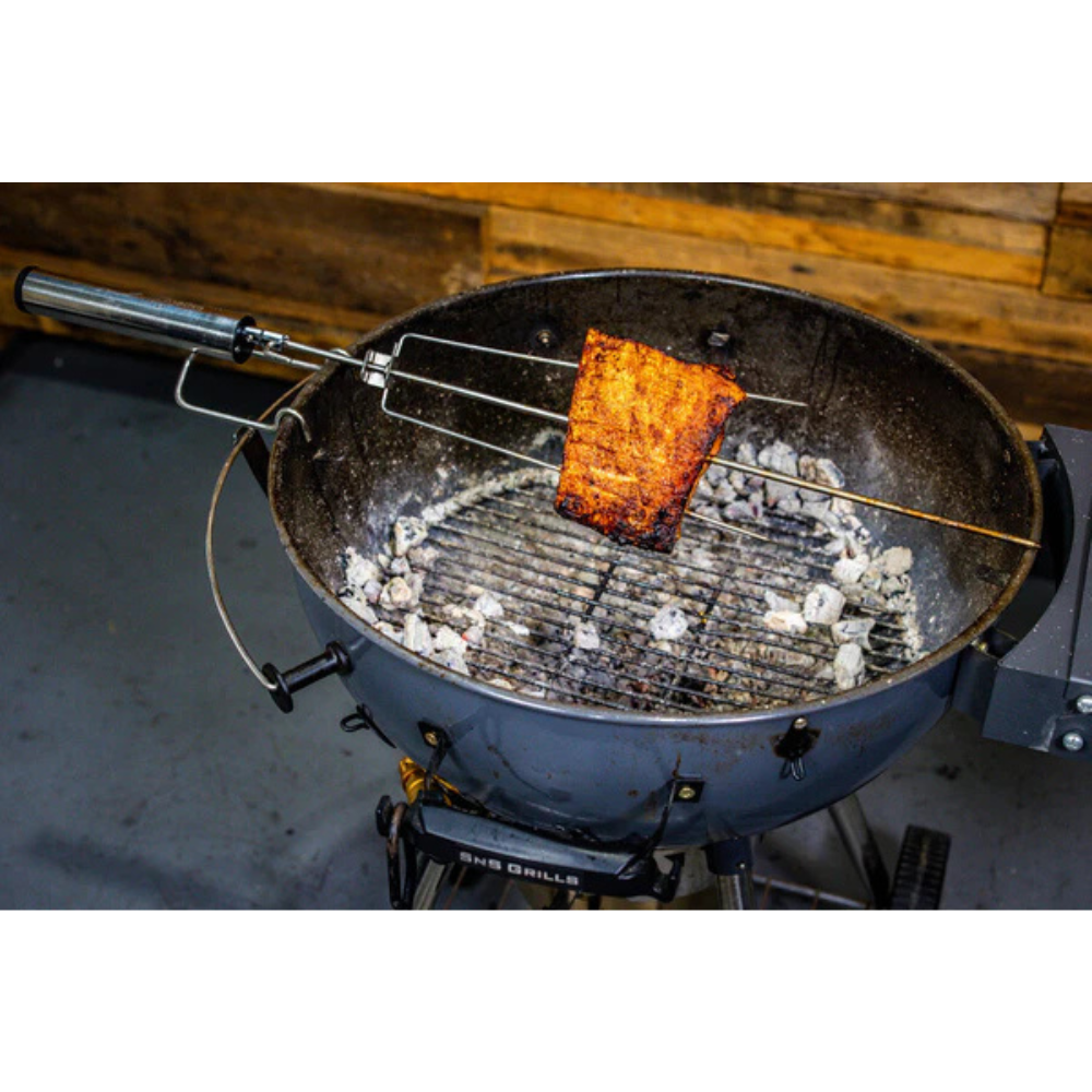 An Espetosul is a motorised battery-powered rotisserie kit that was developed in Brazil. 
It was designed with simplicity and ease of use in mind and works by freestanding over your charcoal BBQ.