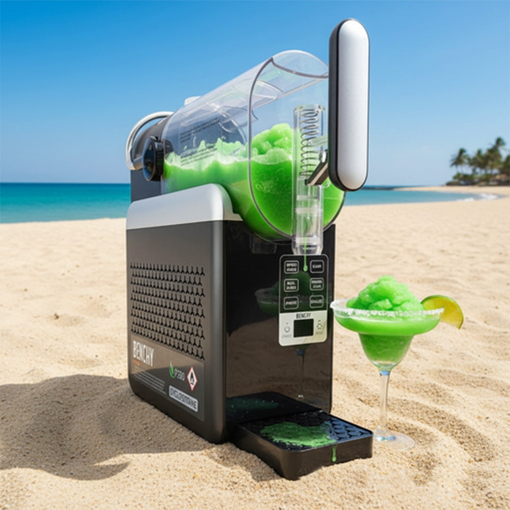 Benchy Slushy Machine with a green frozen cocktail being dispensed on the beach.