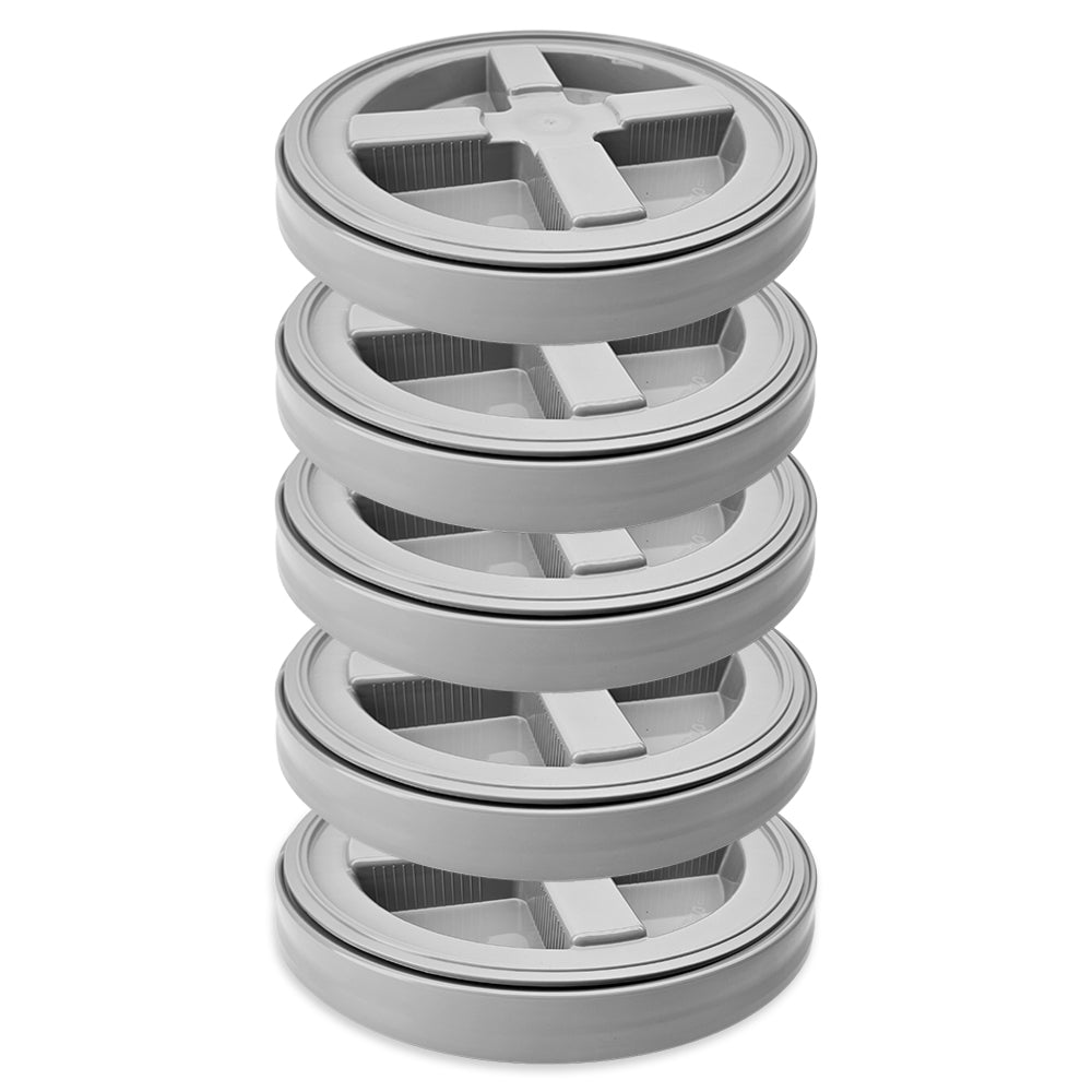 Stack of screwtop lids on a white background