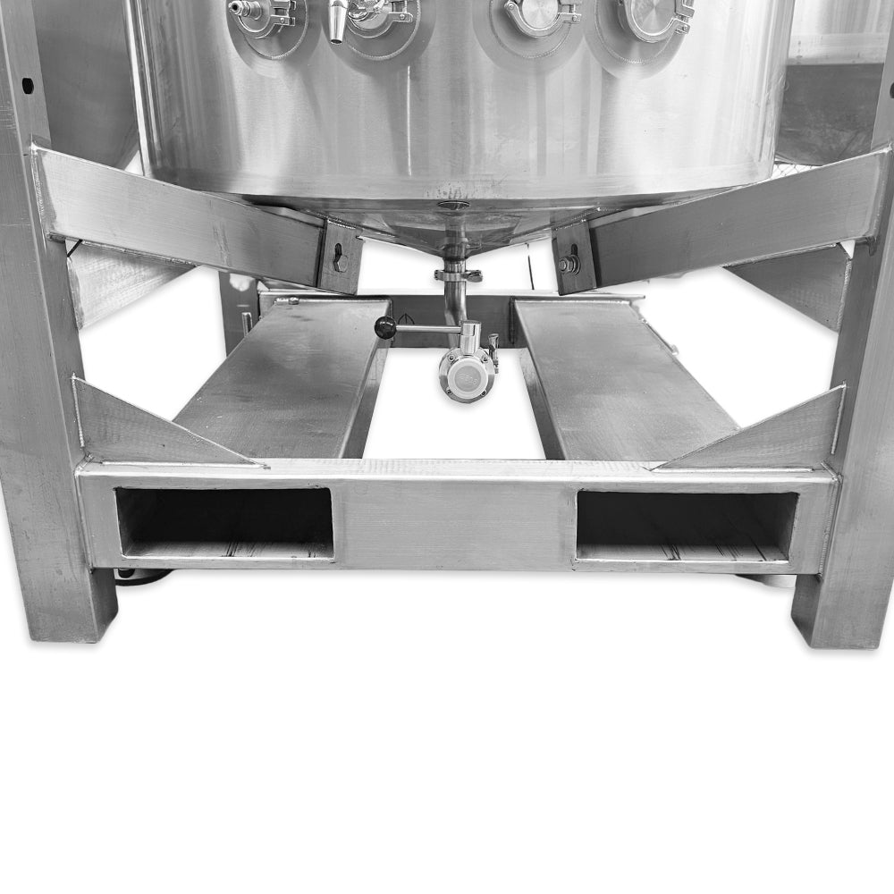 Stainless steel mixing tank with a mechanical agitator on a white background