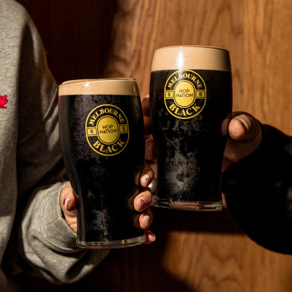 Nitro Stout in Melbourne Black Hop Nation Glassware Being enjoyed with friends