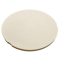 A round, light beige ceramic or stone plate with a small notch on the right edge, shown on a plain white background.