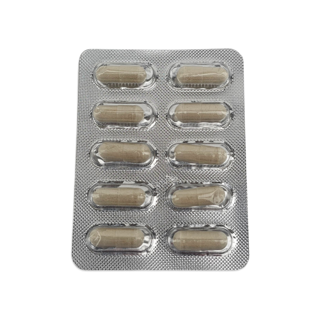 Silver blister pack with beige capsules on a white background
