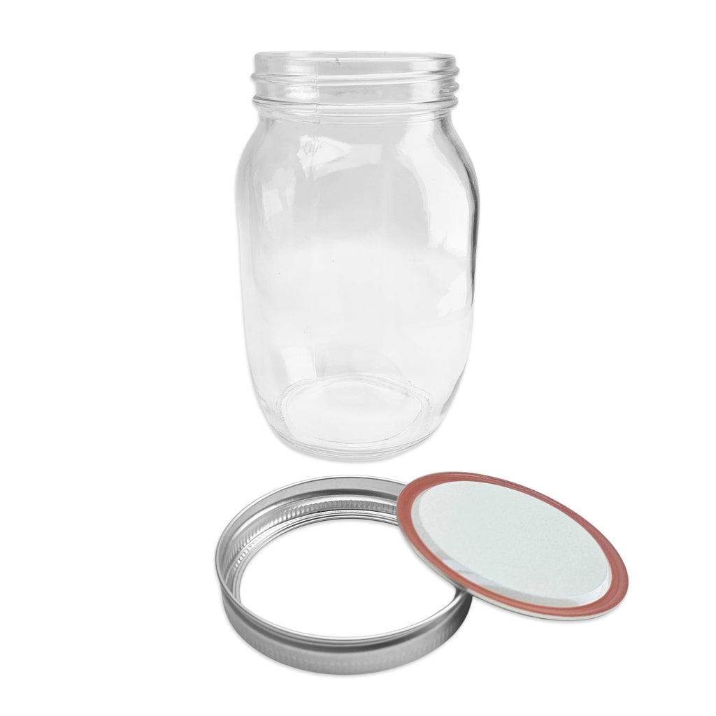 Clear glass jar with a metal lid and gasket on a white background