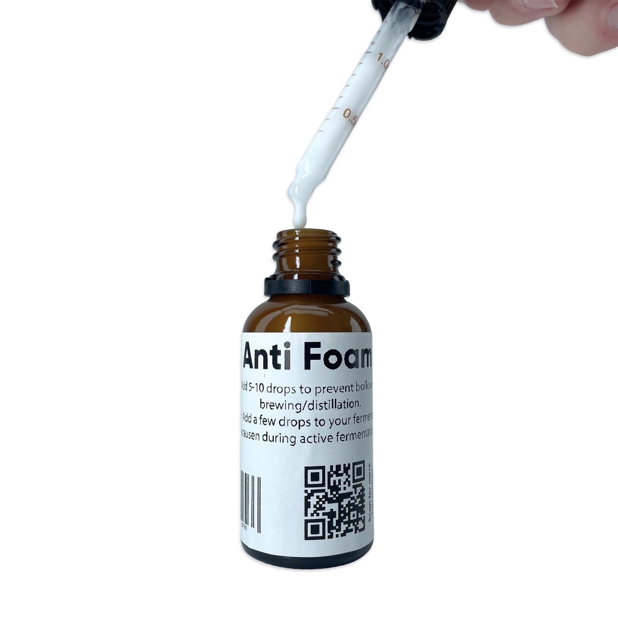 Bottle of Anti Foam with a dropper being used on a white background