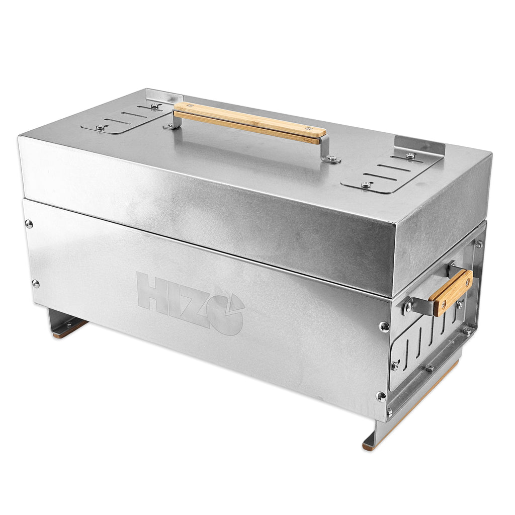 A stainless steel portable wood-burning stove with a top handle and side exhaust, featuring a debossed HIZO logo on the front, shown on a white background.