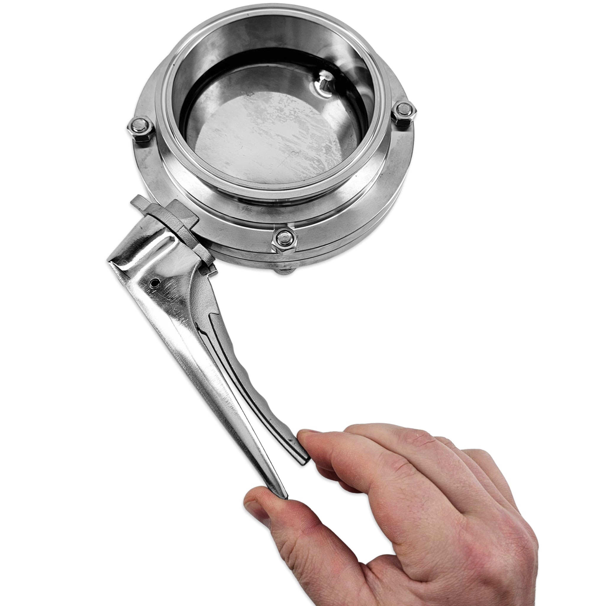 A stainless steel butterfly valve with a hand holding the lever handle, shown against a solid white background.